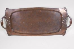 An Arts and Crafts copper tray in the manner of Newlyn, 65 x 27cms