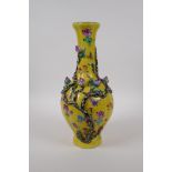 A polychrome porcelain vase with raised peach tree decoration on a yellow ground, Chinese Qianlong