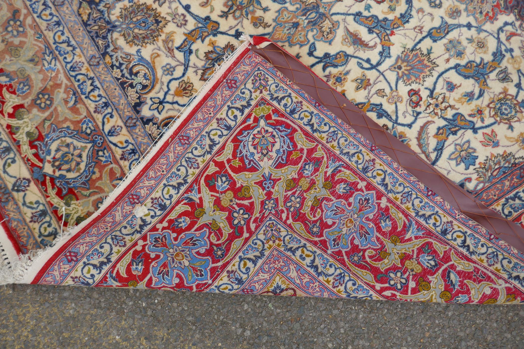 A faded cream ground Persian silk rug, with a floral medallion design and red borders, 160 x 240cms, - Image 4 of 7
