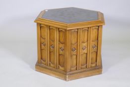 Oak pedestal with Gothic style panels, single cupboard door and inset composite top, 66 x 54cms