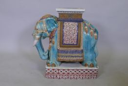 A vintage Chinese ceramic garden seat in the form of an elephant, with majolica glazed decoration,