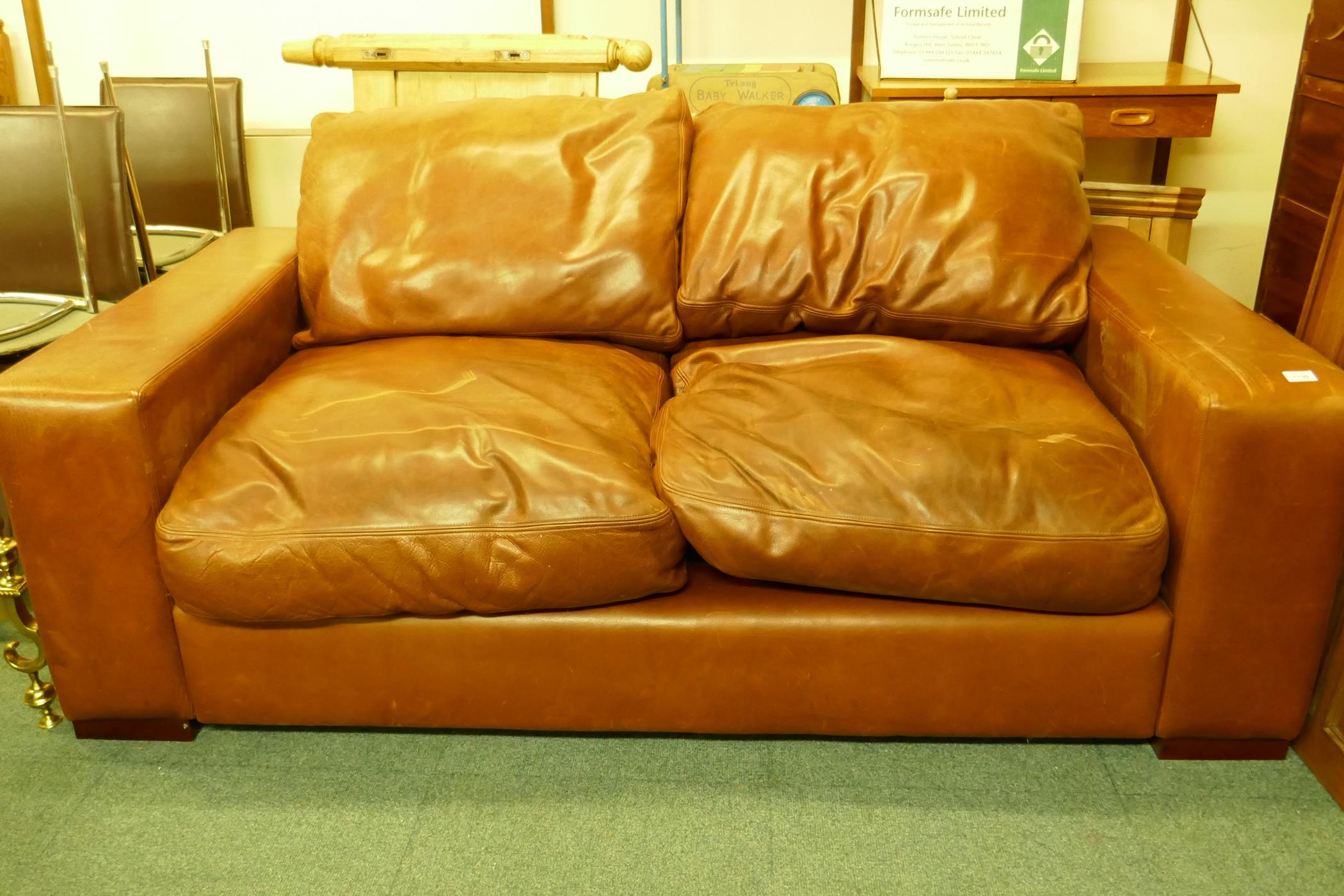 A leather two seater sofa, 190cm wide