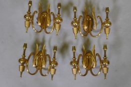 A set of four Italian gilt brass two branch wall sconces, labelled Sciolari, Rome, 20cm high