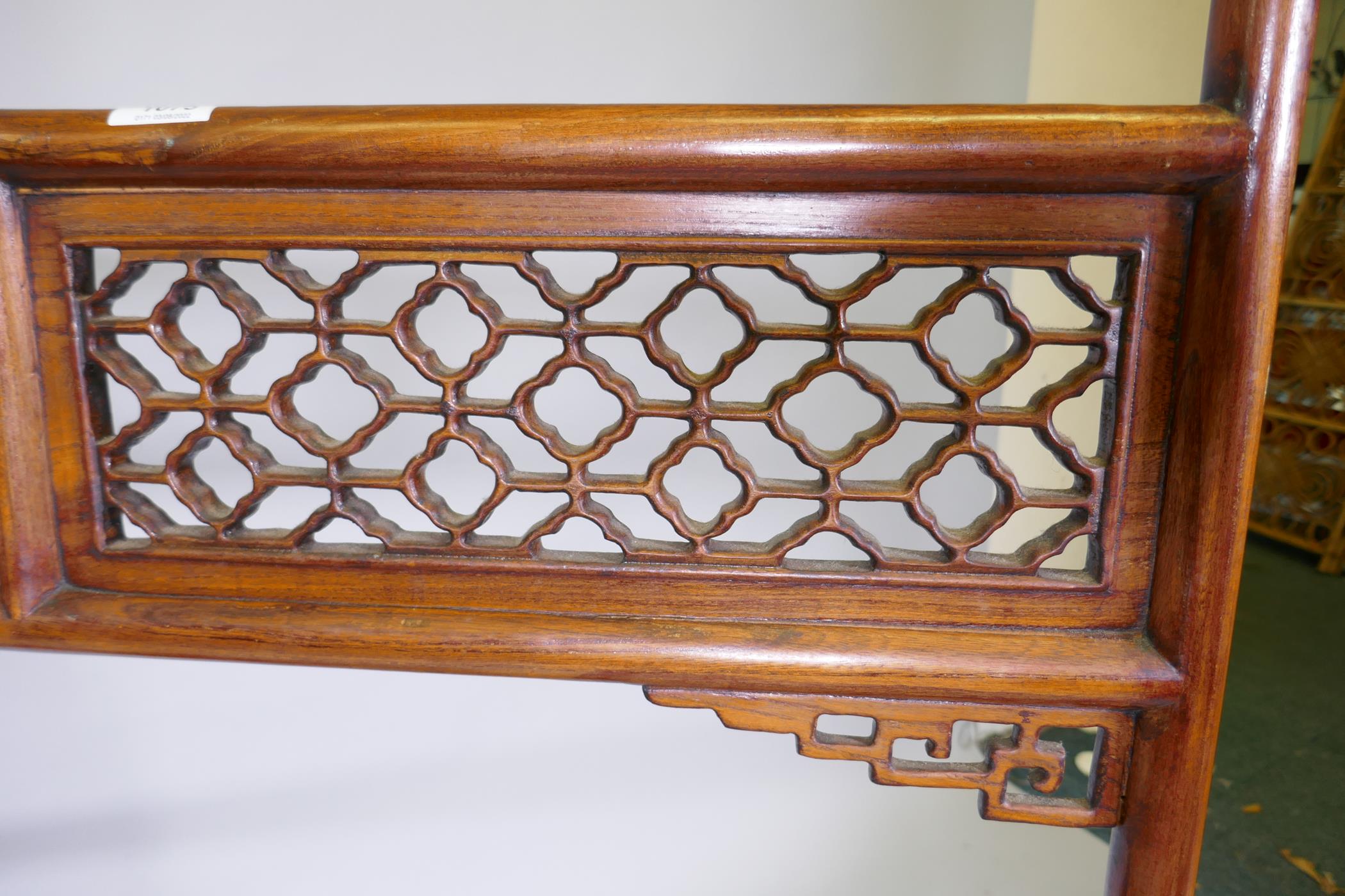 A Chinese carved wood robe rack with decorative pierced panels, 150cm high, 121cm wide - Image 5 of 5