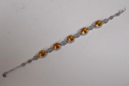 A silver, cubic zirconia and citrine bracelet, 19cm long
