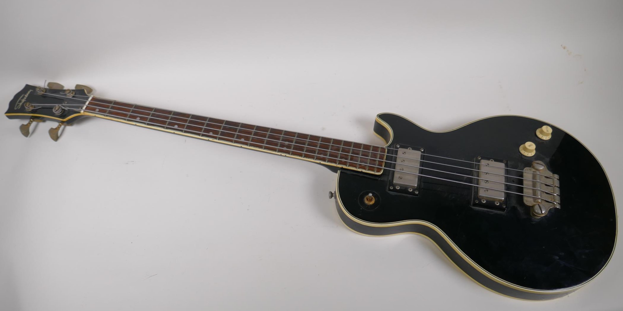 A vintage Japanese built Shaftesbury bass guitar with Les Paul shaped body, 110cm long