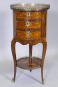 A C19th French  rosewood and mahogany lamp table with marquetry inlaid decoration, pierced brass