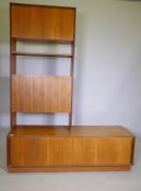 A mid century G Plan Form Five teak modular wall system consisting of a base unit with sliding doors