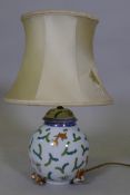A Herencd porcelain table lamp with hand painted decoration of swimming carp, 30cm high