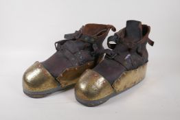 A pair of early C20th Swedish deep sea diving boots, with leather body, brass toe caps and sides,