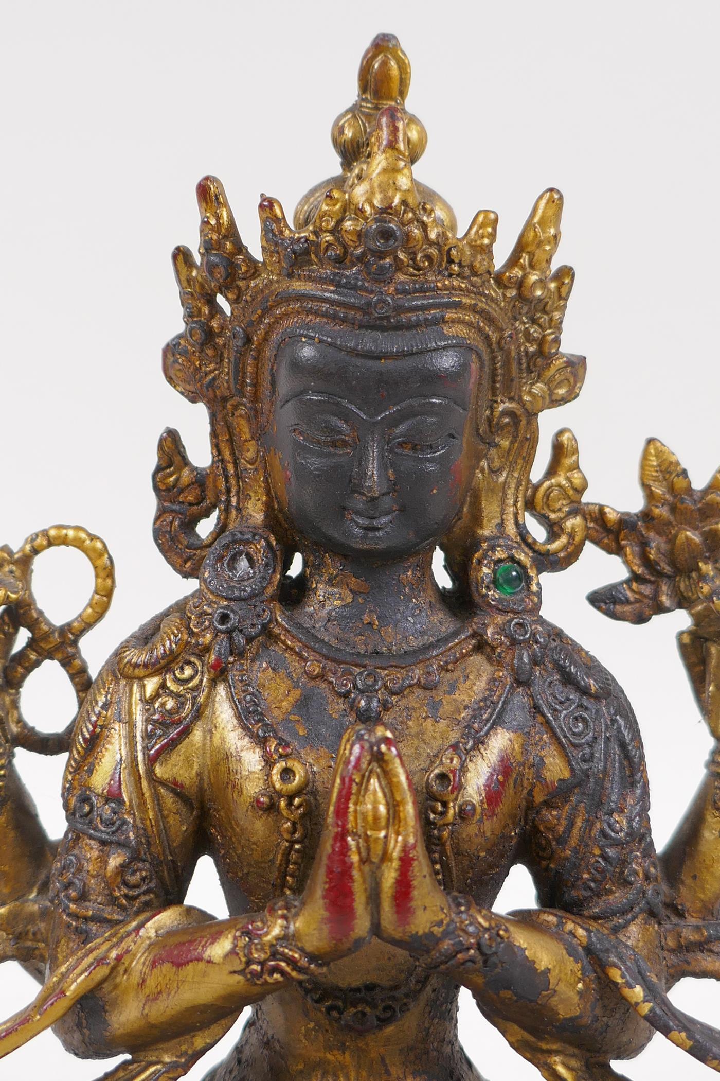 A Sino Tibetan gilt bronze of Buddha seated on a lotus throne, 21cm high - Image 2 of 4