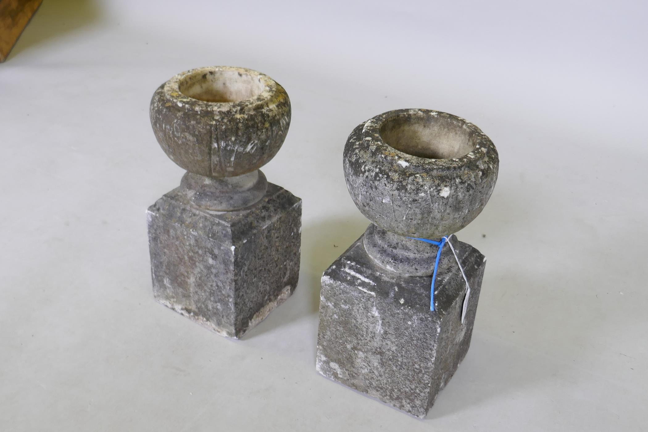A pair of small garden urns on square pedestals, 34cm high - Image 2 of 3