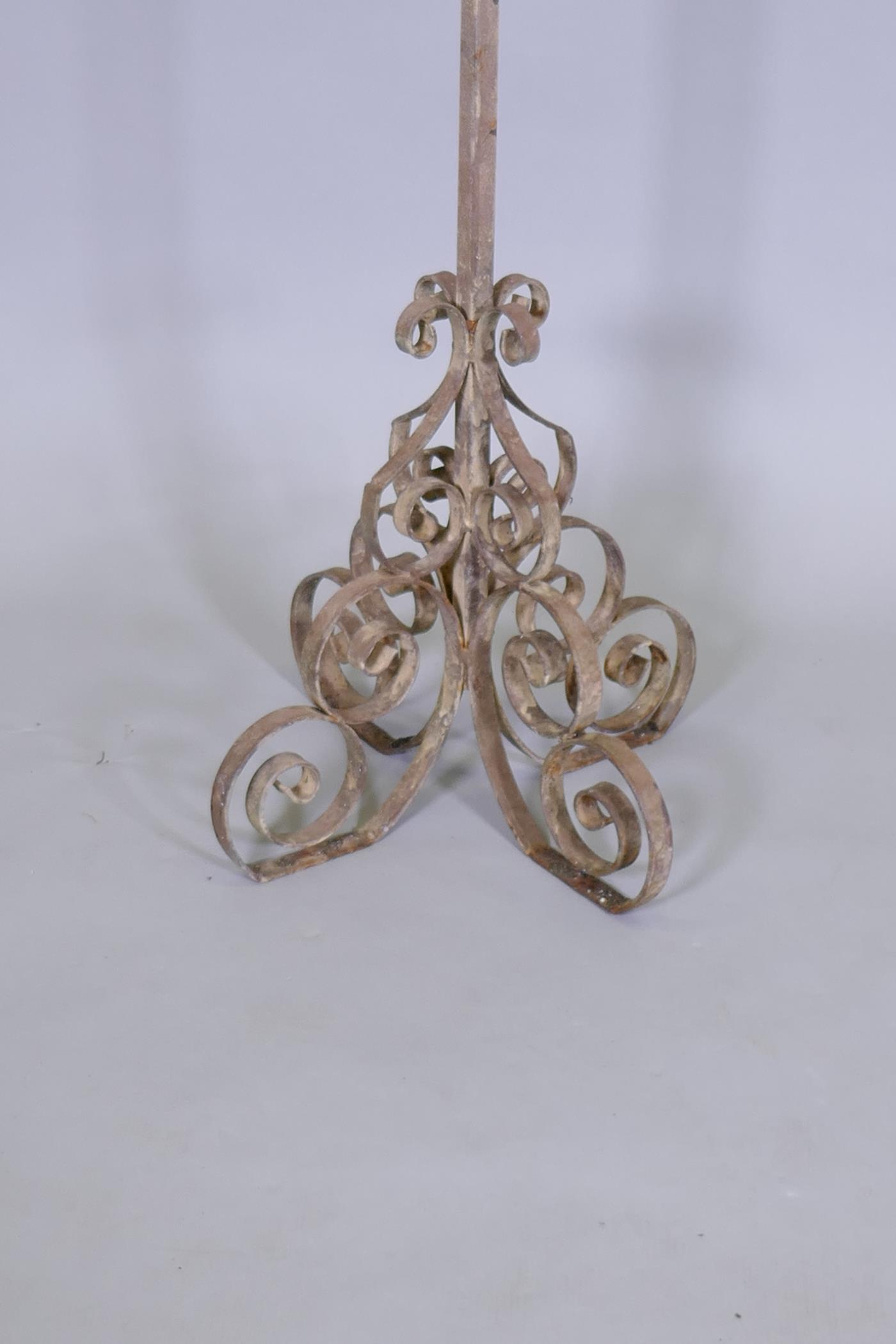 A wrought iron stand with four open work hooks and scrollwork base and artichoke finial, 160cm high - Image 2 of 2