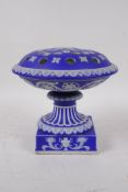 A C19th Wedgwood Jasperware urn with a flower frog, 17cm high x 17cm diameter