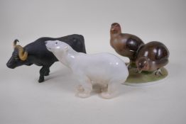 A Coalport porcelain figure of a water buffalo, 22cm long, a continental porcelain figure of two