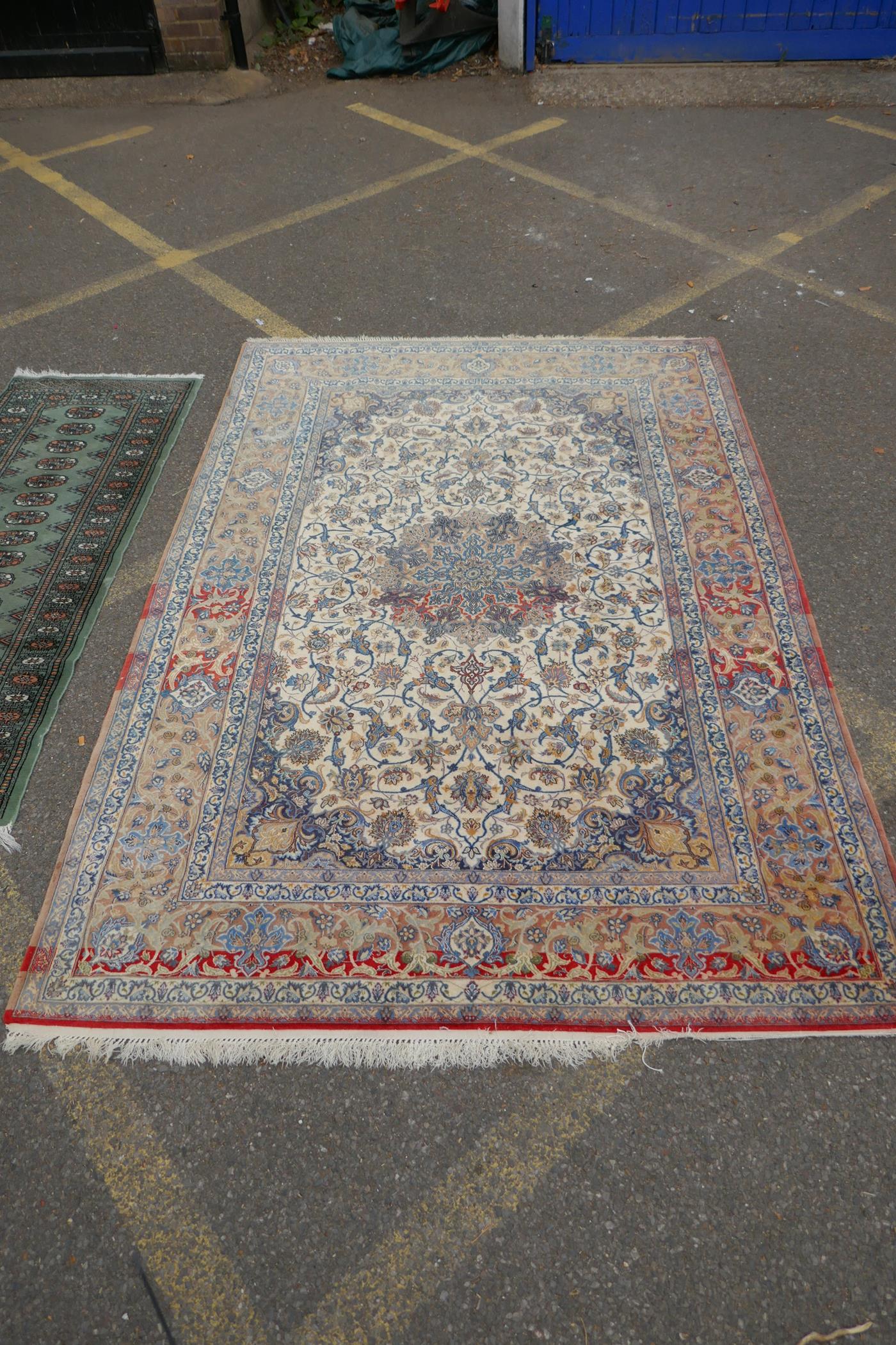 A faded cream ground Persian silk rug, with a floral medallion design and red borders, 160 x 240cms, - Image 3 of 7