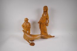 A carved wood figure of a woman in medieval costume, 47cm high, and a carved figure of a boy with