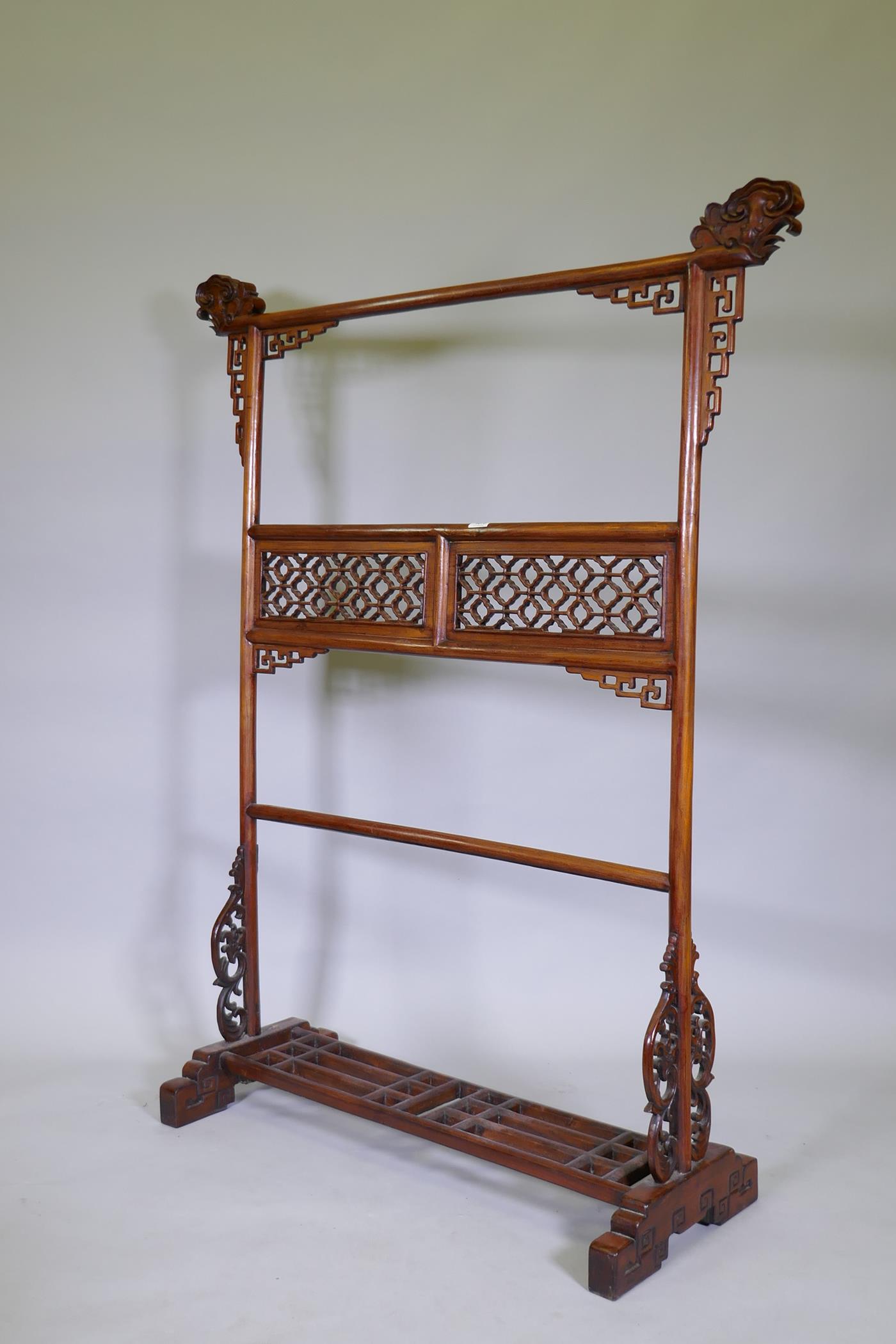A Chinese carved wood robe rack with decorative pierced panels, 150cm high, 121cm wide - Image 2 of 5