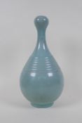 A Chinese ru ware style garlic head shaped porcelain vase with ribbed details, inscription to