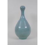 A Chinese ru ware style garlic head shaped porcelain vase with ribbed details, inscription to
