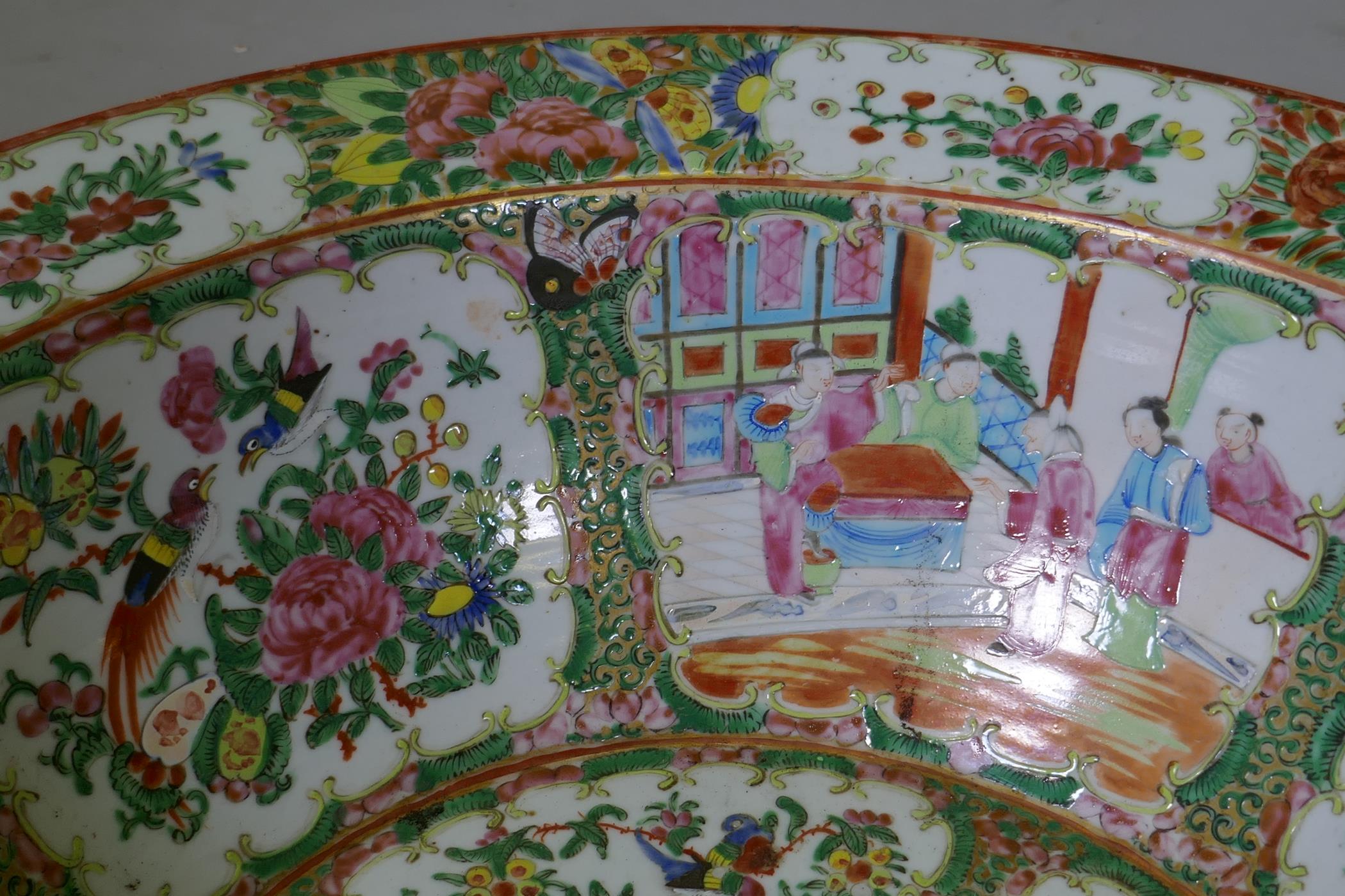 A C19th Cantonese famille rose ceramic bowl, decorated with birds, butterflies and figures, 47cm - Image 3 of 7