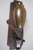 A vintage wall mounted brass, iron and glass coffee mill, 24cm long