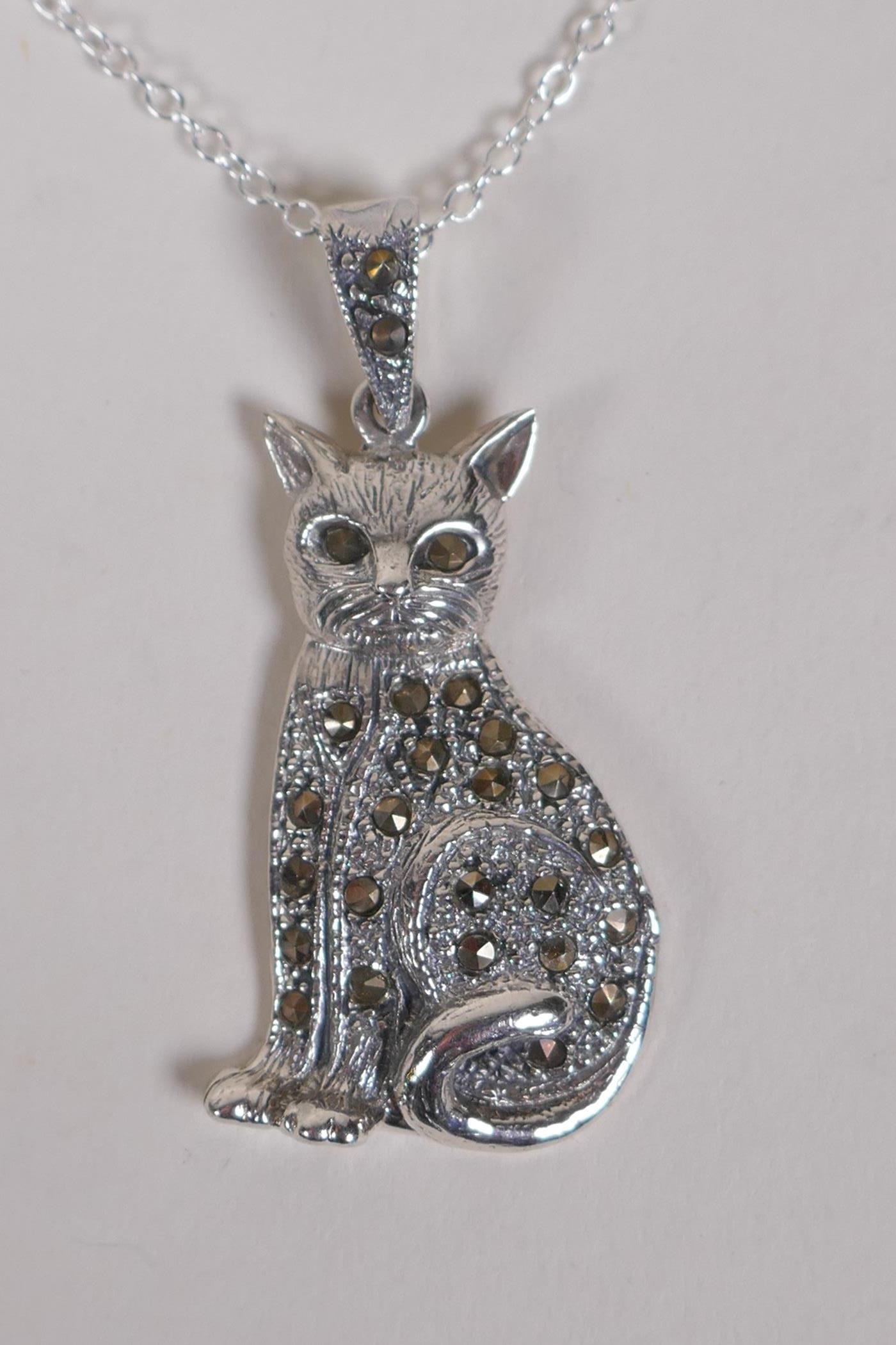 A silver and marcasite cat pendant necklace, 4cm drop