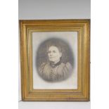 A large photograph of an Edwardian lady in a good quality moulded gilt picture frame, aperture 41