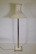 Brass Corinthian column floor lamp with inset marble base, 145cm high, with shade 180cm