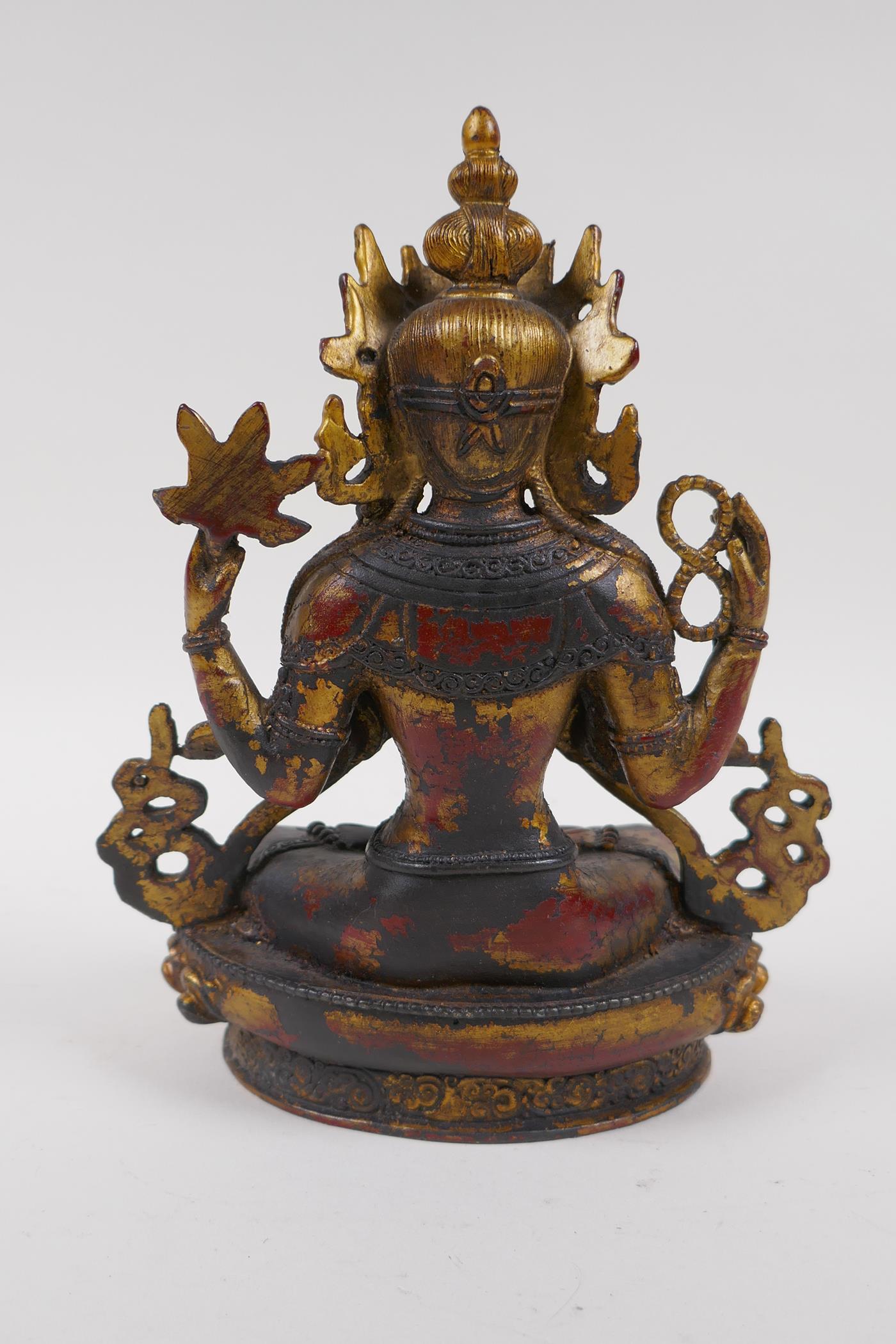 A Sino Tibetan gilt bronze of Buddha seated on a lotus throne, 21cm high - Image 3 of 4