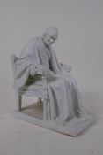 After Jean-Antoine Houdon, a parian figure of Voltaire, 22cm high