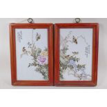 A pair of Chinese famille vert porcelain plaques depicting birds amongst flowers, in hardwood