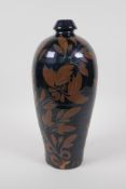 A Chinese Cizhou kiln pottery vase with copper lustre floral decoration, 30cm high