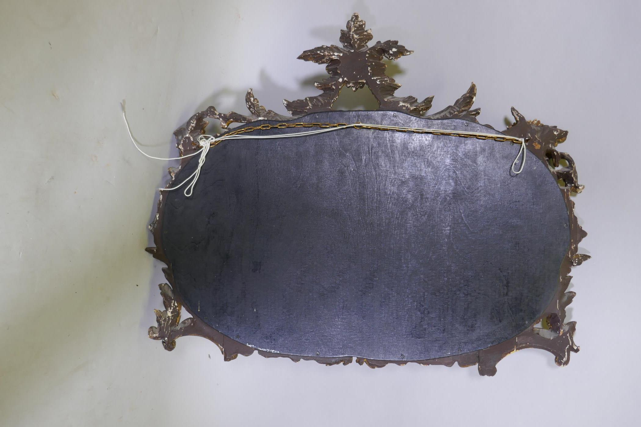An antique carved giltwood wall mirror, 76 x 63cms - Image 3 of 3