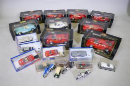 Nine boxed die cast model cars by Burago, and five smaller models by Corgi, five other vehicles