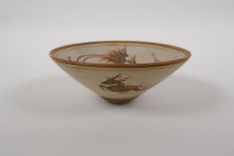 A Chinese Cizhou kiln conical bowl with phoenix, deer and floral decoration, 14cm diameter