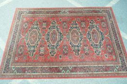 A red ground Persian pattern Belgian rug, 200 x 140cms