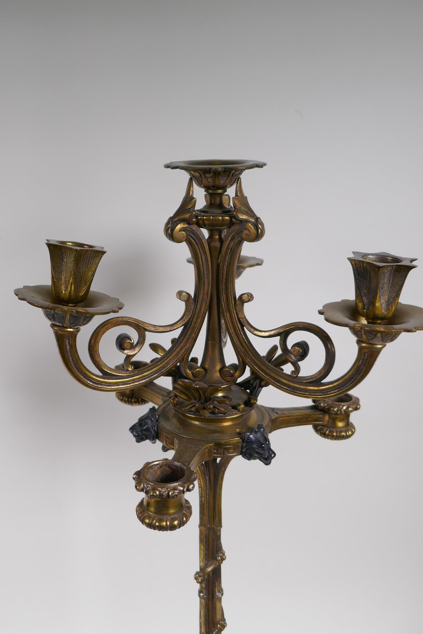 A pair of cold painted brass and three branch table lamps, with silver plated and ormolu detail, - Image 4 of 7