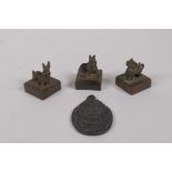 Three Chinese cast bronze seals with zodiac animal mounts, and a bronze ganesh pendant, seals 2.5