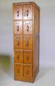 A tall office / shop cabinet of ten drawers with metal handles, 152cm high, 41cm wide, 59cm deep