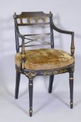 A Regency painted and parcel gilt tub shaped arm chair, with pierced back, raised on turned