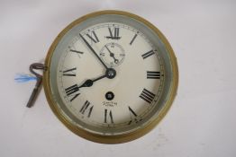 A mid C20th brass cased Smiths Astral bulk head ship's clock, 17cm diameter