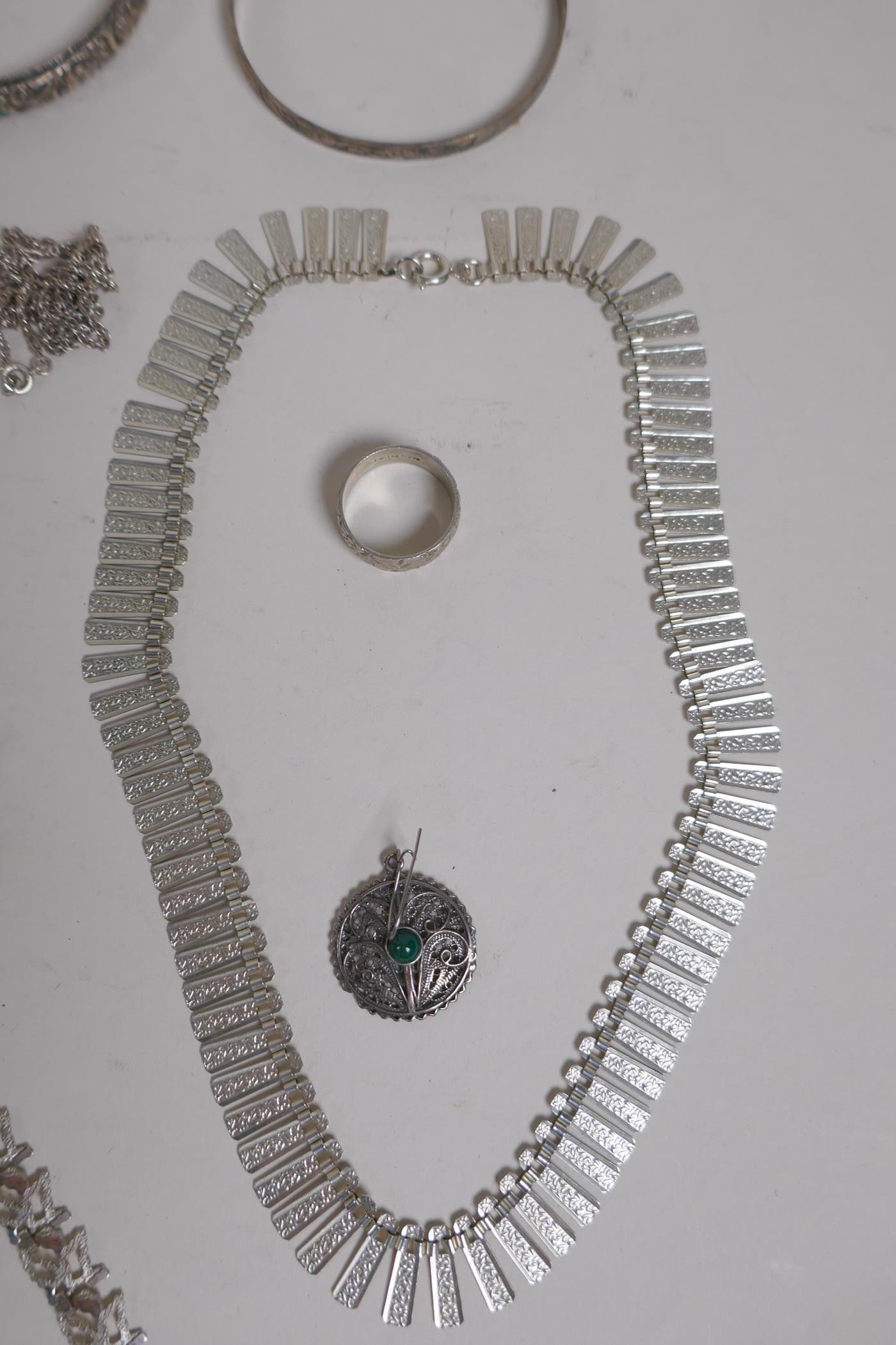 A collection of hallmarked silver jewellery, bangles, chains and necklaces, 199g - Image 2 of 7