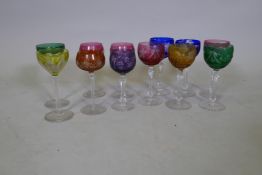 Six cut and coloured drinking glasses, and six others, 19cm high