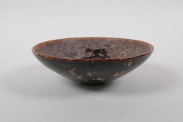 A Chinese Cizhou kiln dish with mythical creature decoration, 14cm diameter