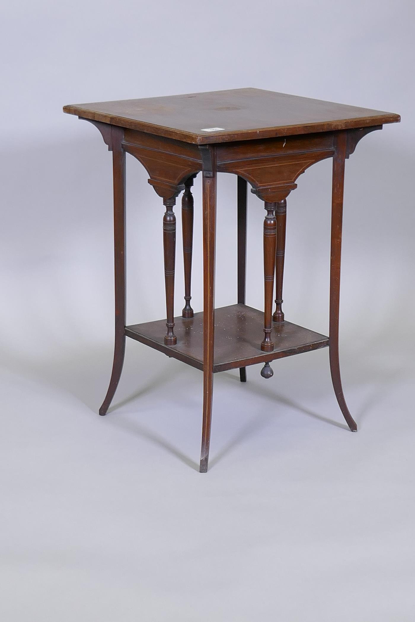 Victorian two tier rosewood occasional table, with boxwood lining, raised on sabre supports, one