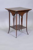 Victorian two tier rosewood occasional table, with boxwood lining, raised on sabre supports, one