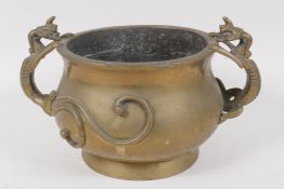 A Chinese bronze jardiniere, the handles cast as mythical beasts, 20cm diameter, cast seal mark to
