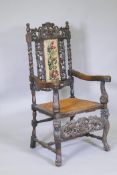C19th beechwood open armchair with carved and pierced back, scrolling arms and lion and heraldic