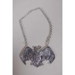 A silver plated brandy bottle label in the form of a bat, 8 x 5cms